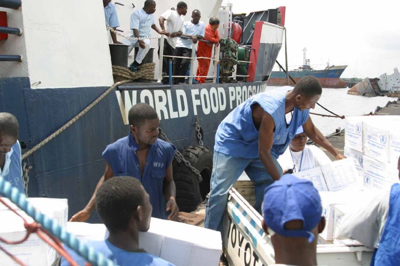 Casual Laborers with the WFP (World Food Program) load food rations onto a truck in the Free Port of Monrovia.
Official USMC photo by Corporal Marcus L. Miller